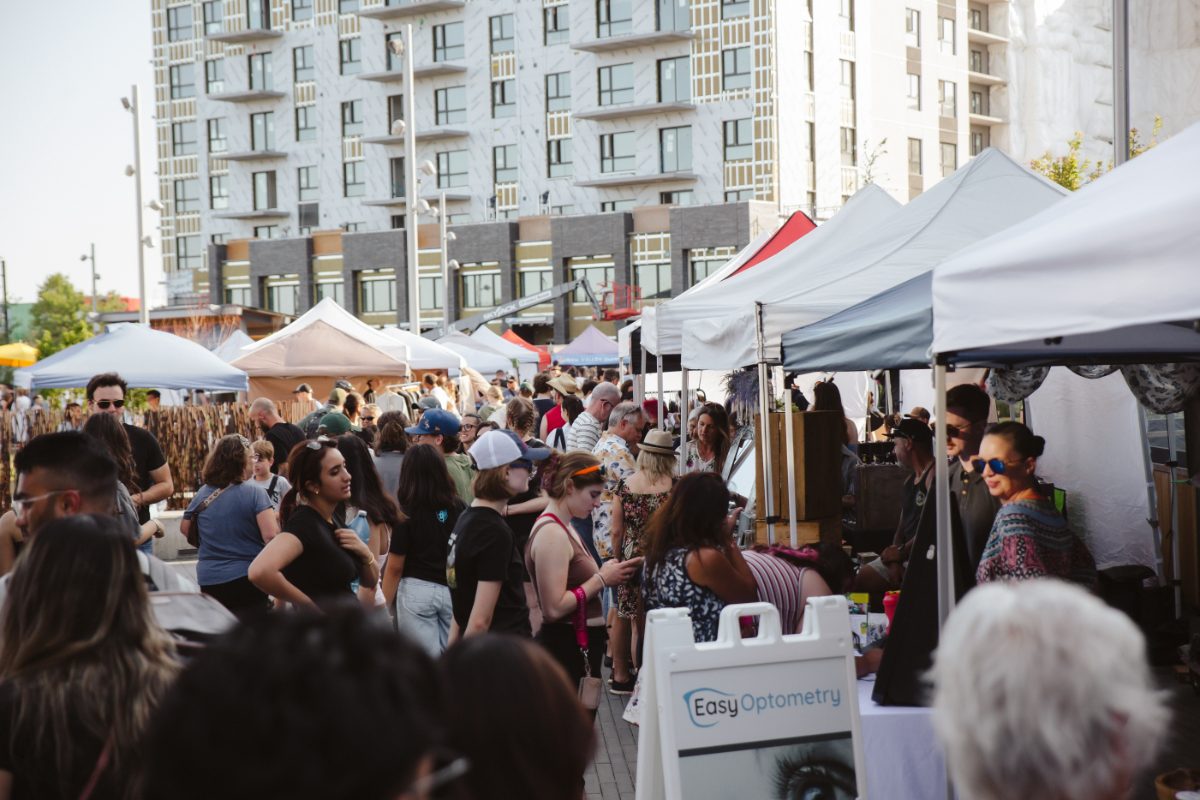 Shoppers packed between vendor tents