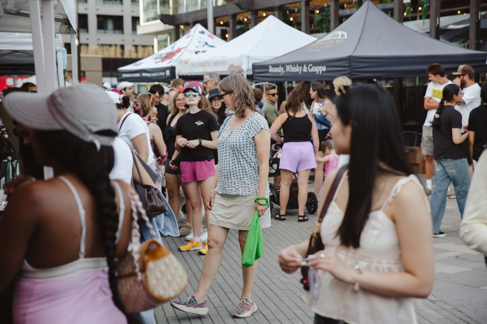 Shoppers browsing the market on a warm evening